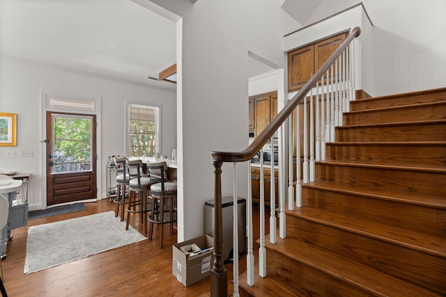 stairs featuring dark hardwood / wood-style floors