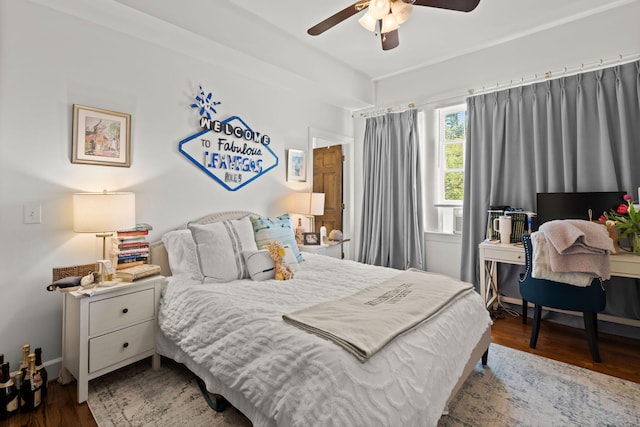 bedroom featuring hardwood / wood-style flooring and ceiling fan