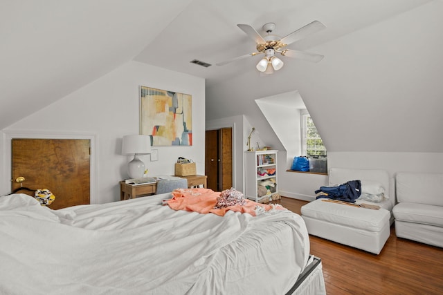 bedroom with hardwood / wood-style floors, ceiling fan, and lofted ceiling