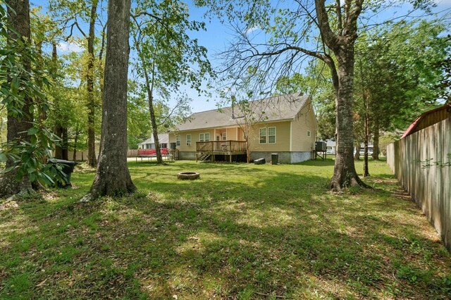 213 Travelers Rest Blvd, Summerville, SC 29485 - view of yard with a wooden deck, fence, and an outdoor fire pit
