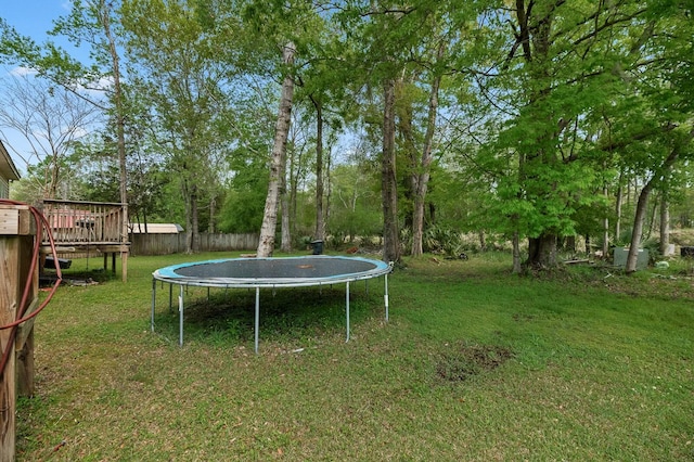 213 Travelers Rest Blvd, Summerville, SC 29485 - view of yard with fence, a trampoline, and a deck