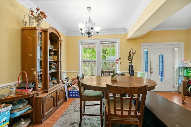 213 Travelers Rest Blvd, Summerville, SC 29485 - dining space featuring crown molding, light wood-style flooring, and a notable chandelier
