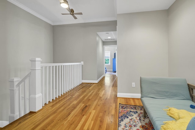 hall with crown molding and hardwood / wood-style flooring