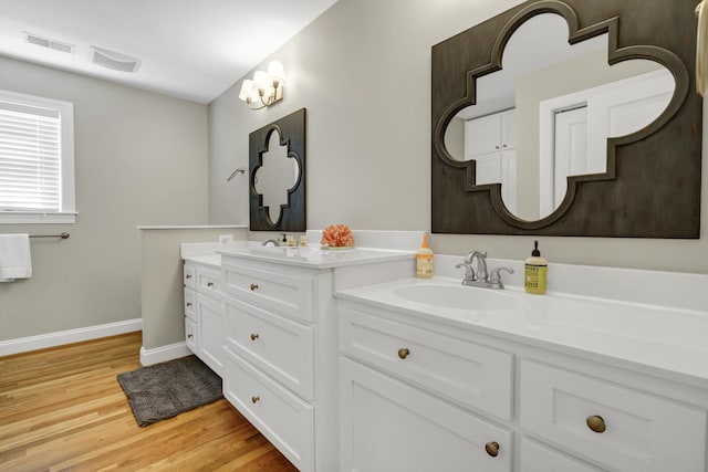 bathroom with vanity and hardwood / wood-style floors