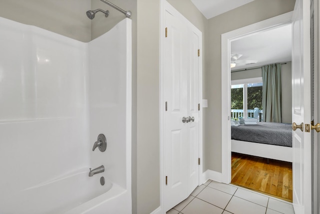 bathroom with tile patterned floors and bathing tub / shower combination