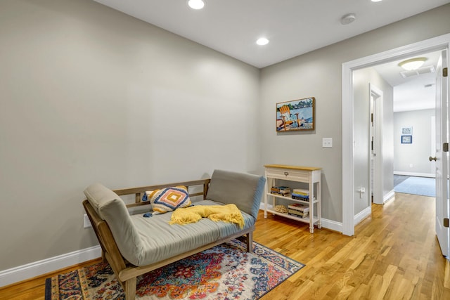 sitting room with light hardwood / wood-style flooring