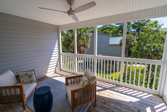 sunroom / solarium with ceiling fan