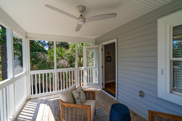 wooden deck with ceiling fan