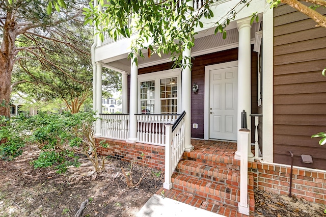 property entrance featuring a porch