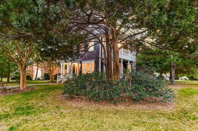 view of home's exterior featuring a lawn