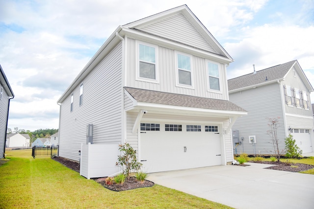 view of front of home featuring a front lawn and a garage