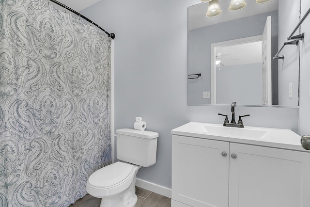 full bath featuring vanity, a shower with curtain, baseboards, tile patterned floors, and toilet