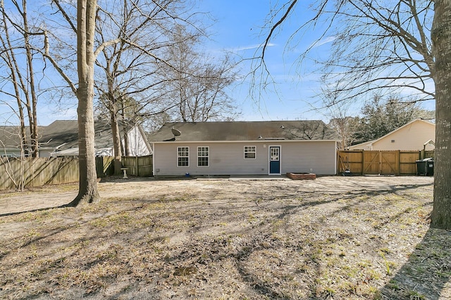 back of property with fence