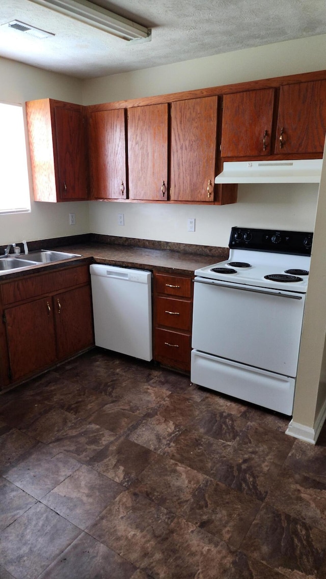 kitchen with sink and white appliances