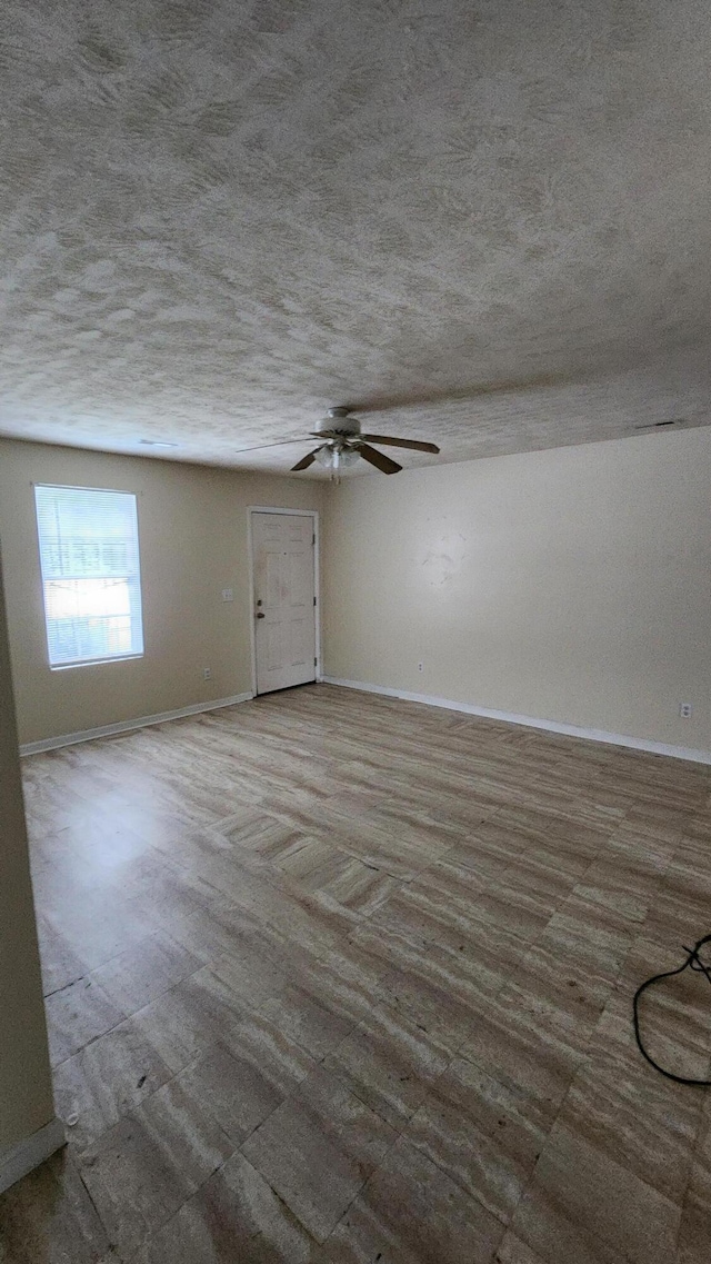 spare room featuring a textured ceiling