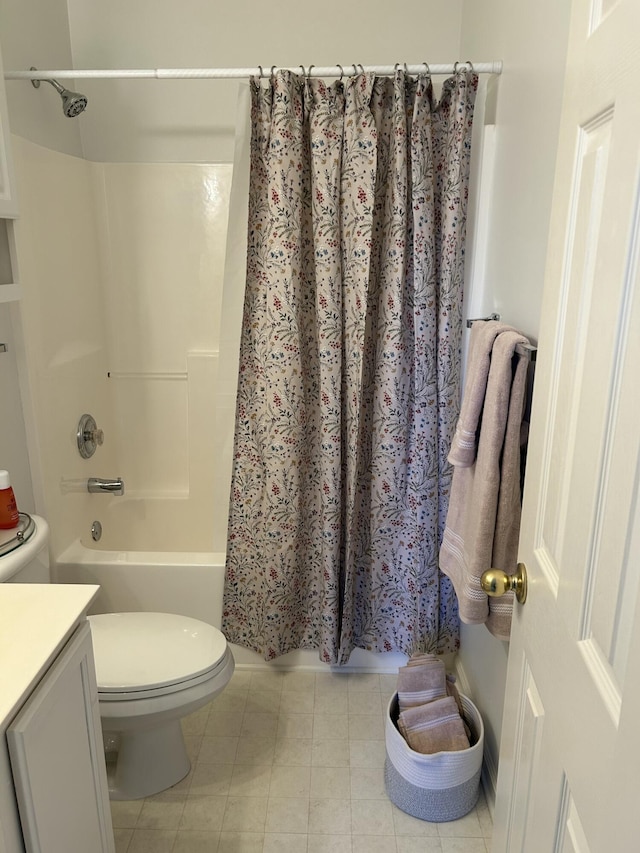 full bathroom with vanity, shower / bath combo, and toilet