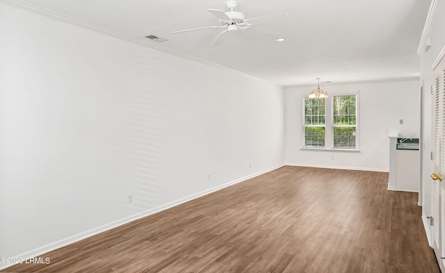 unfurnished living room with crown molding, dark hardwood / wood-style floors, and ceiling fan with notable chandelier