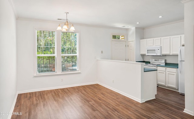 kitchen with white cabinetry, an inviting chandelier, white appliances, and decorative light fixtures