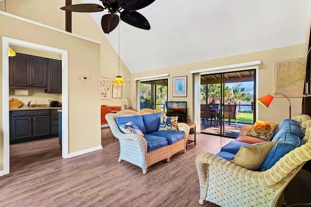 7897 Russell Creek Dr, Edisto Island, SC 29438 - living area with wood finished floors, high vaulted ceiling, ceiling fan, and baseboards