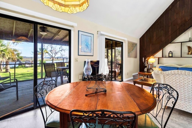 7897 Russell Creek Dr, Edisto Island, SC 29438 - dining space featuring light wood-type flooring, ceiling fan, and vaulted ceiling