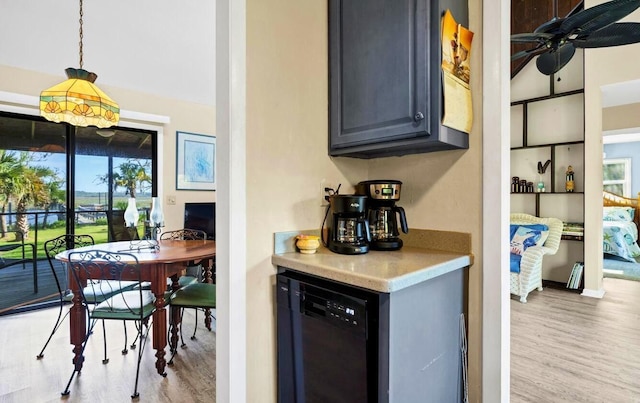 7897 Russell Creek Dr, Edisto Island, SC 29438 - bar featuring black dishwasher, light wood-type flooring, hanging light fixtures, and ceiling fan