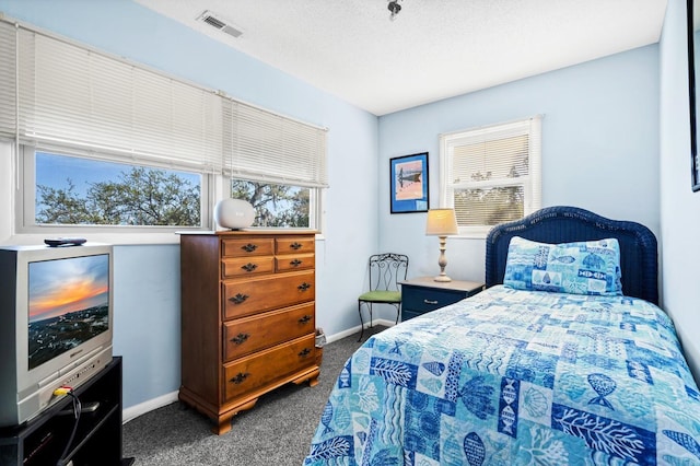 7897 Russell Creek Dr, Edisto Island, SC 29438 - bedroom with dark carpet and baseboards