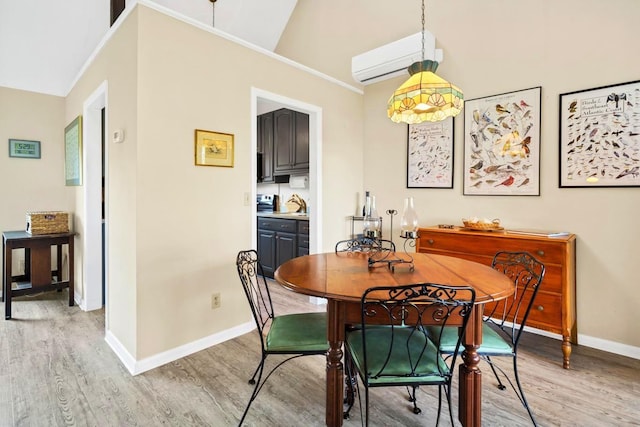 7897 Russell Creek Dr, Edisto Island, SC 29438 - dining area with a wall mounted air conditioner, light wood-style floors, baseboards, vaulted ceiling, and ornamental molding