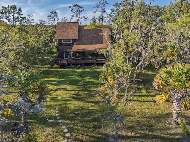 7897 Russell Creek Dr, Edisto Island, SC 29438 - back of property featuring a yard, a wooden deck, and a shingled roof
