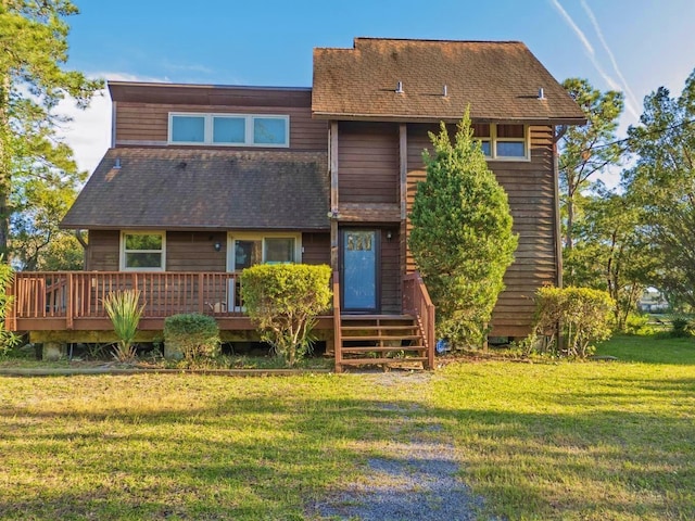 7897 Russell Creek Dr, Edisto Island, SC 29438 - rear view of property with a deck, a yard, and a shingled roof