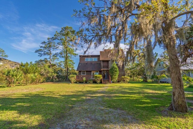7897 Russell Creek Dr, Edisto Island, SC 29438 - view of green lawn featuring a deck