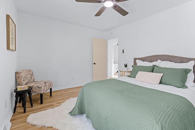 bedroom featuring light hardwood / wood-style flooring and ceiling fan