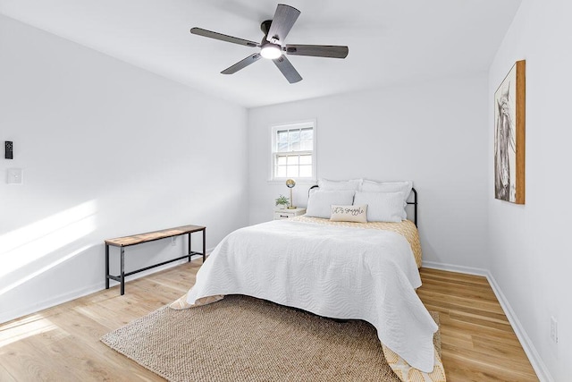 bedroom featuring hardwood / wood-style flooring and ceiling fan