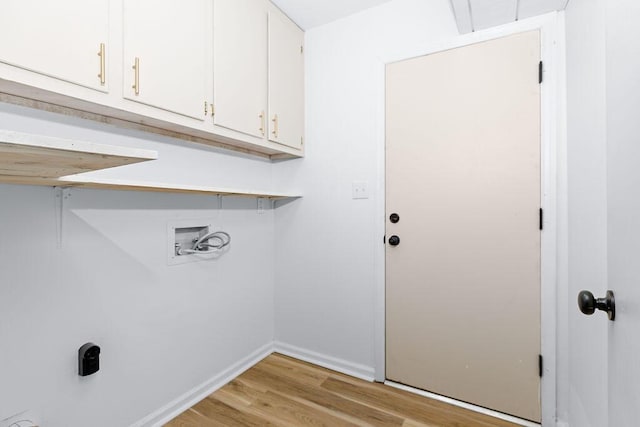 laundry room with washer hookup, electric dryer hookup, cabinets, and light wood-type flooring