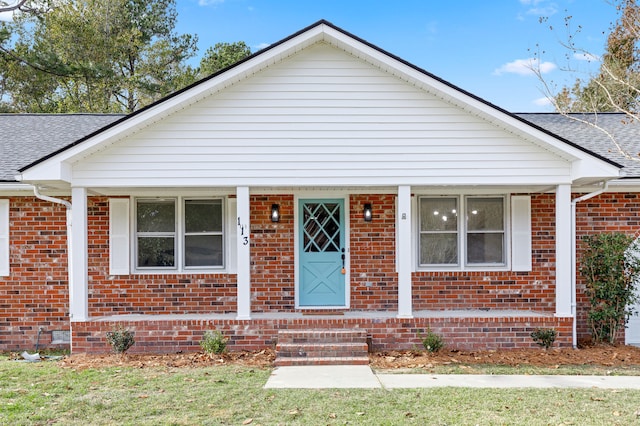 bungalow-style house with a front yard