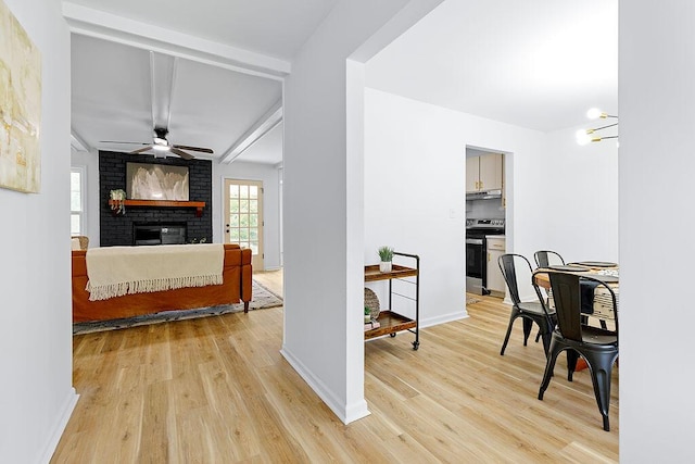 hall with beam ceiling and light hardwood / wood-style flooring