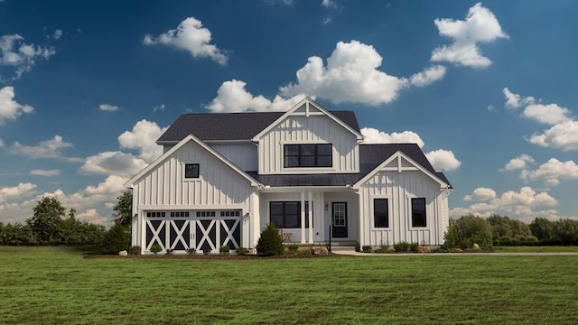 view of front facade featuring a front yard and a garage