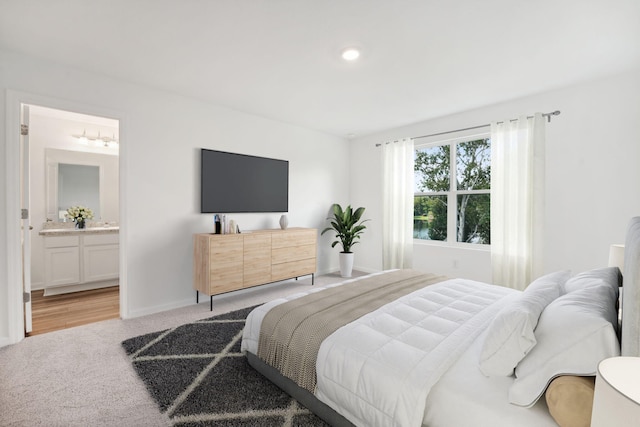 2007 Scarlett Maple St, Summerville, SC 29486 - bedroom featuring light colored carpet, baseboards, connected bathroom, and recessed lighting