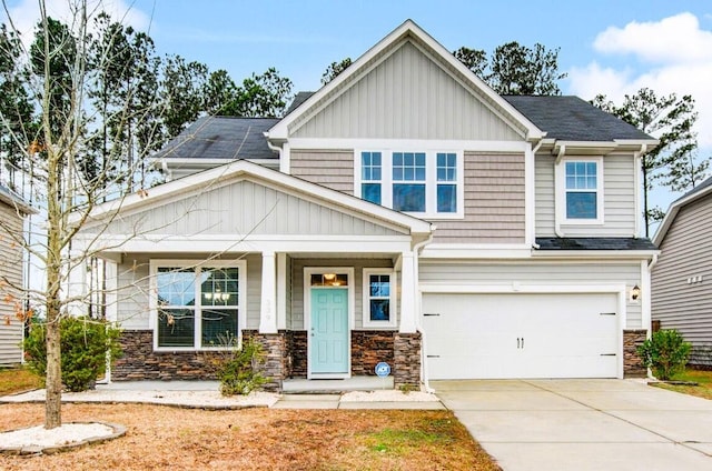 339 Spectrum Rd, Summerville, SC 29486 - craftsman-style house featuring an attached garage, stone siding, driveway, and board and batten siding