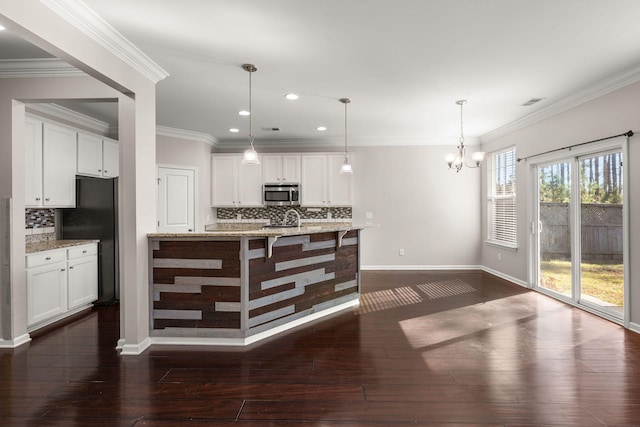 kitchen with white cabinetry, decorative backsplash, and light stone countertops