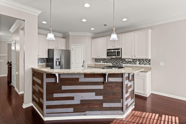 kitchen featuring light stone countertops, white cabinets, and appliances with stainless steel finishes