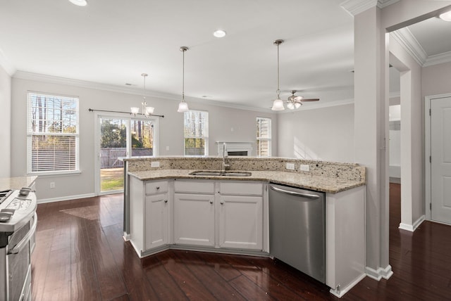 kitchen featuring ceiling fan with notable chandelier, white cabinets, stainless steel appliances, sink, and ornamental molding