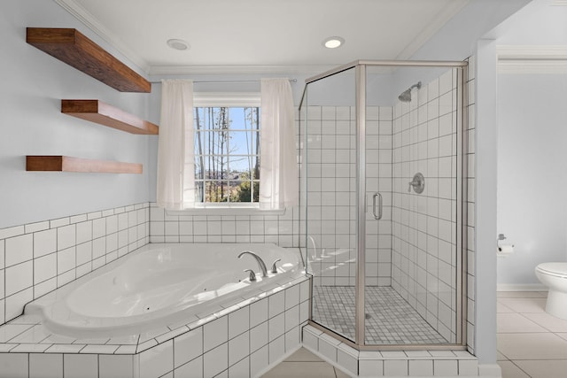 bathroom featuring tile patterned flooring, toilet, ornamental molding, and plus walk in shower