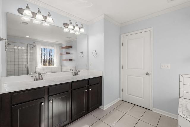 bathroom featuring vanity, a shower with door, tile patterned floors, and crown molding