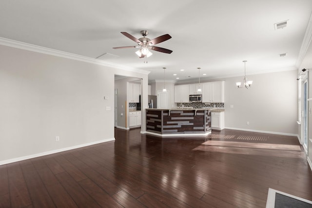 living room featuring crown molding, ceiling fan with notable chandelier, and dark hardwood / wood-style floors