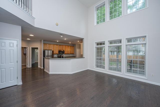 1629 Jorrington St, Mount Pleasant, SC 29466 - unfurnished living room with dark wood-style floors and a high ceiling