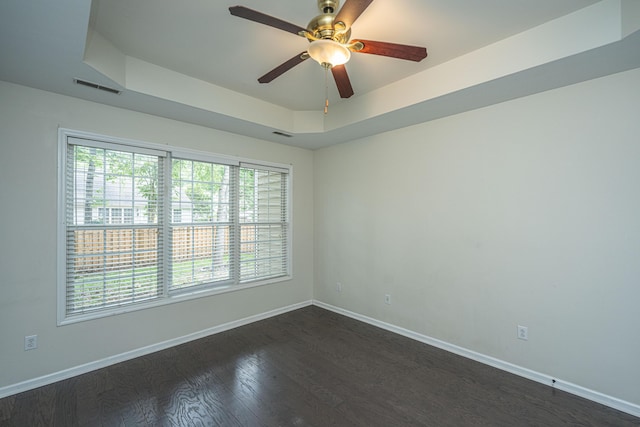 1629 Jorrington St, Mount Pleasant, SC 29466 - empty room featuring a tray ceiling, dark wood-style floors, and a ceiling fan