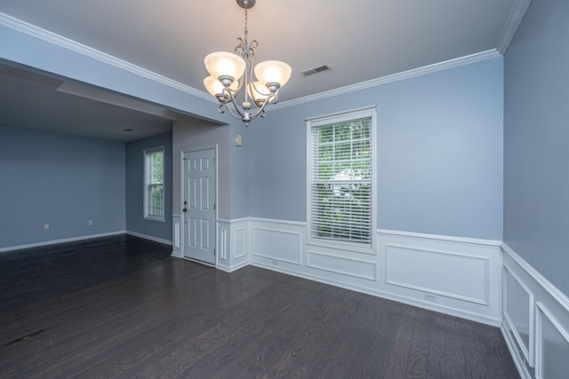 1629 Jorrington St, Mount Pleasant, SC 29466 - empty room featuring a chandelier, dark wood-style floors, plenty of natural light, wainscoting, and crown molding