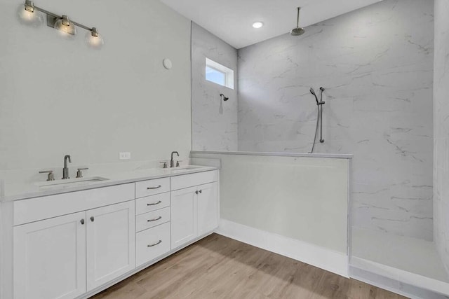1183 Reserve Ln, Awendaw, SC 29429 - full bathroom with a marble finish shower, wood finished floors, double vanity, and recessed lighting