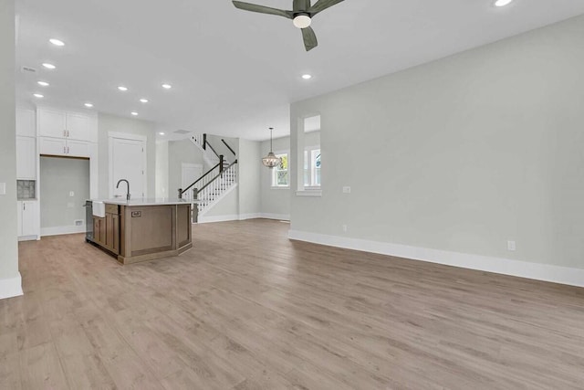 1183 Reserve Ln, Awendaw, SC 29429 - kitchen featuring open floor plan, recessed lighting, light countertops, light wood finished floors, and ceiling fan