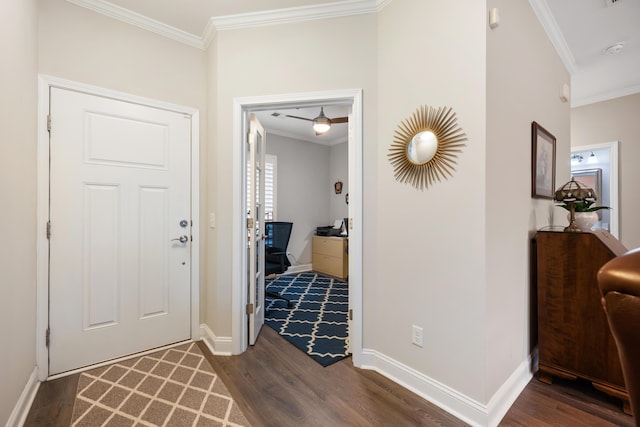 foyer featuring dark hardwood / wood-style flooring and crown molding